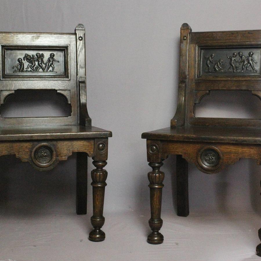 Pair of Oak Hall Chairs inlaid with terracotta plaques