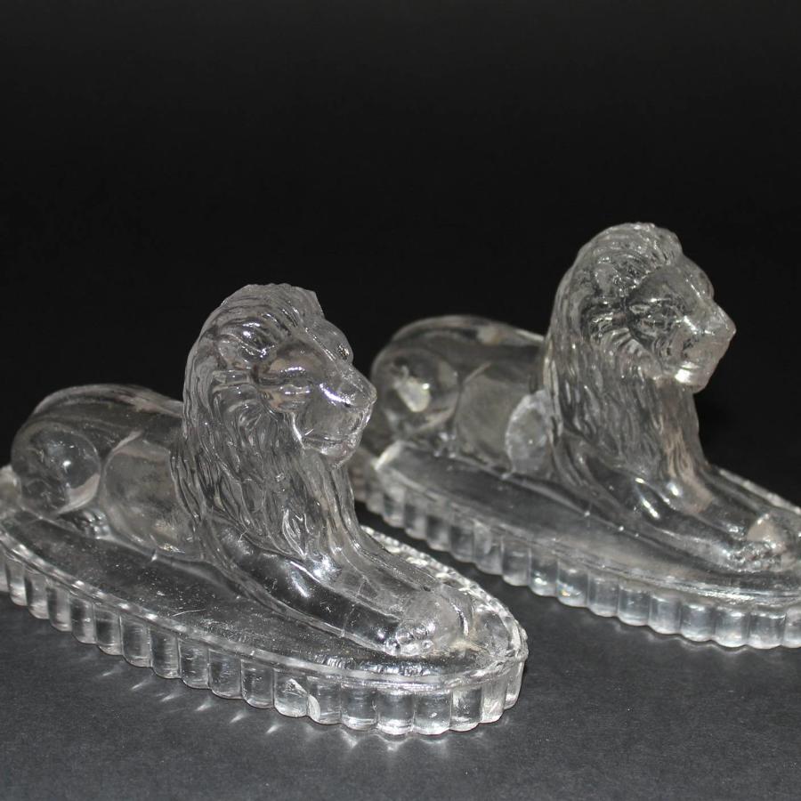 A Pair of John Derbyshire Pressed Glass Lions