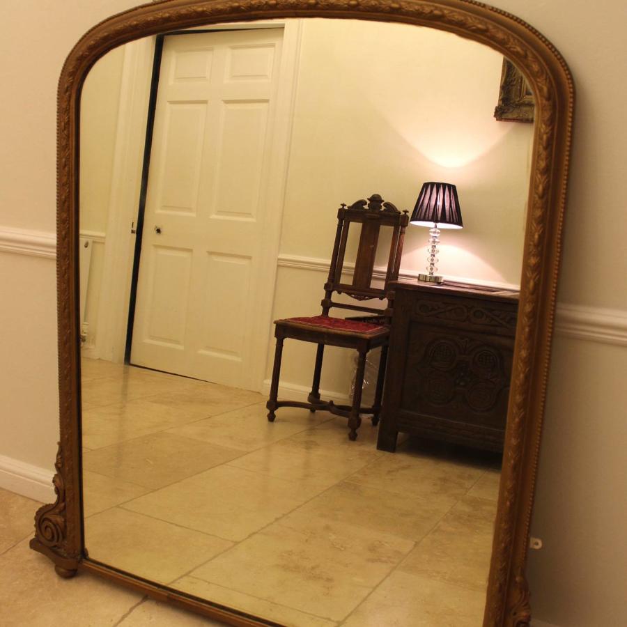 A Large Victorian Gilt Overmantel Mirror