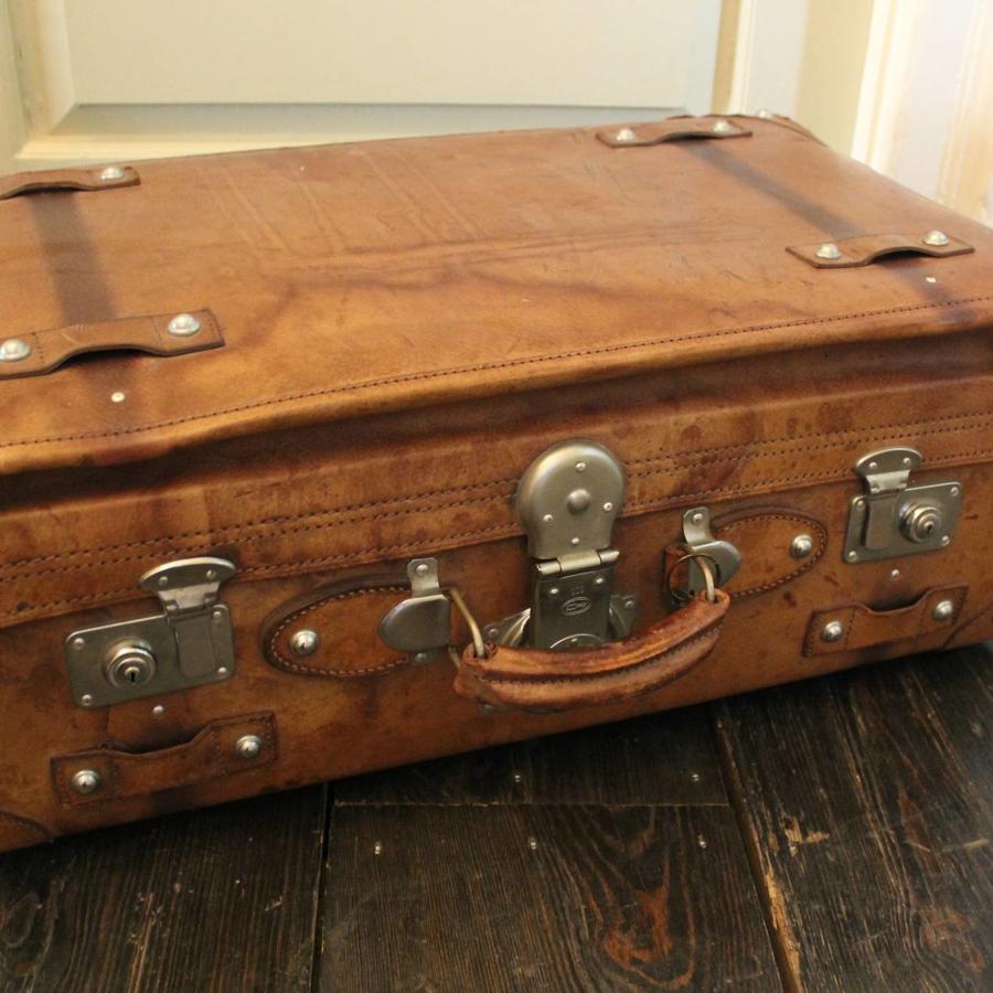 A Vintage Tan Leather Suitcase