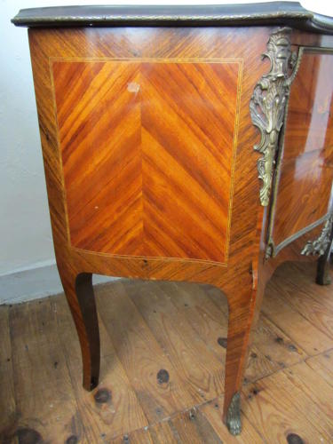A Louis XV Style Kingwood Marquetry Commode with Gilt Metal Mounts