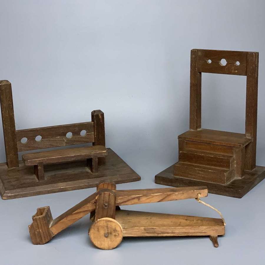 Naive Wooden Models of Instruments of Punishment