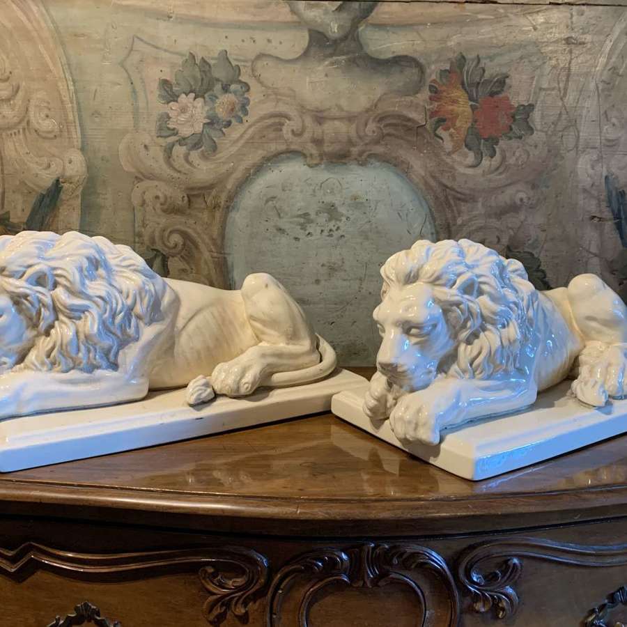 Two Large French Cream Glazed Pottery Lions