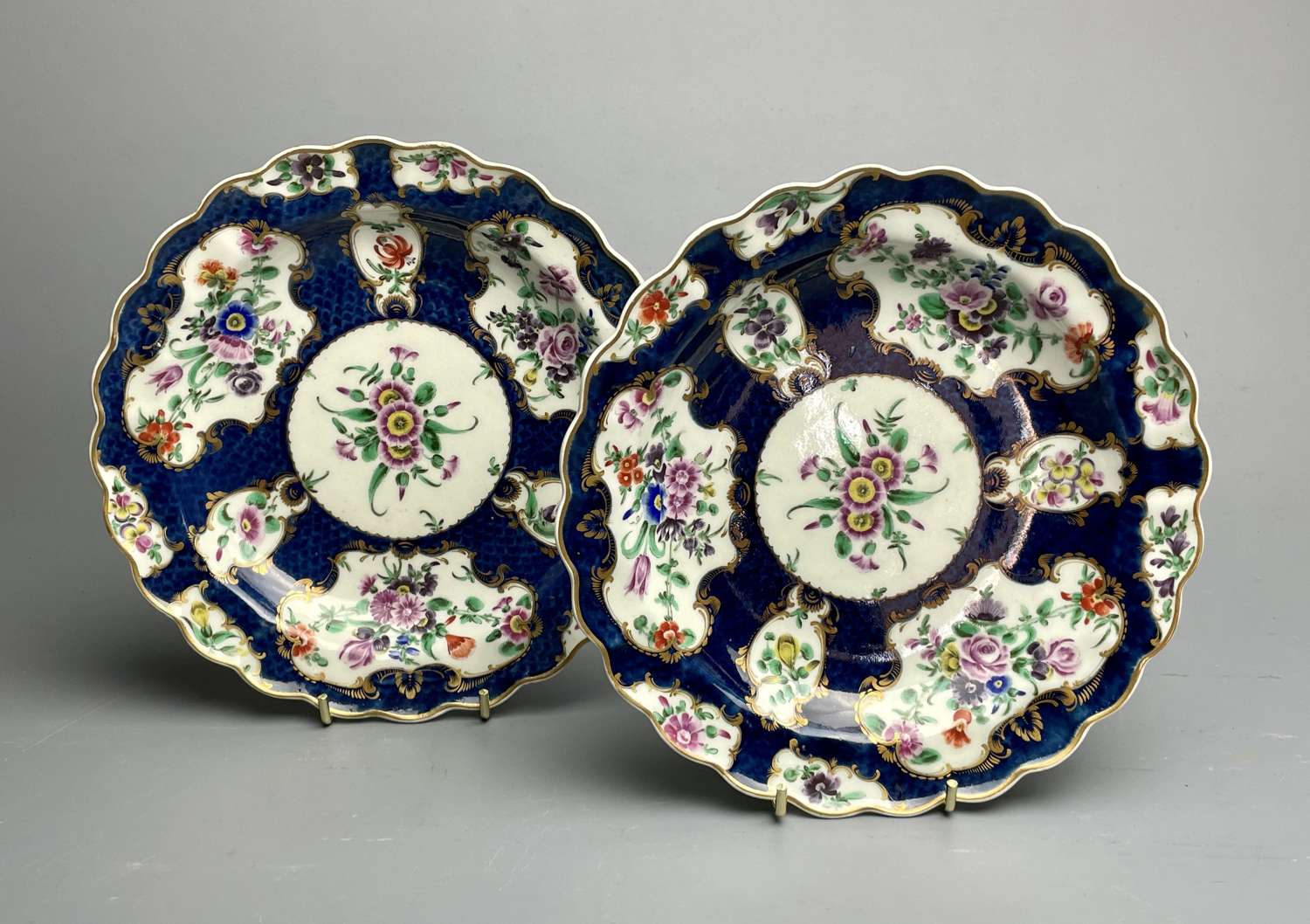 Pair of First Period Worcester Blue Scale Ground Shallow Dishes