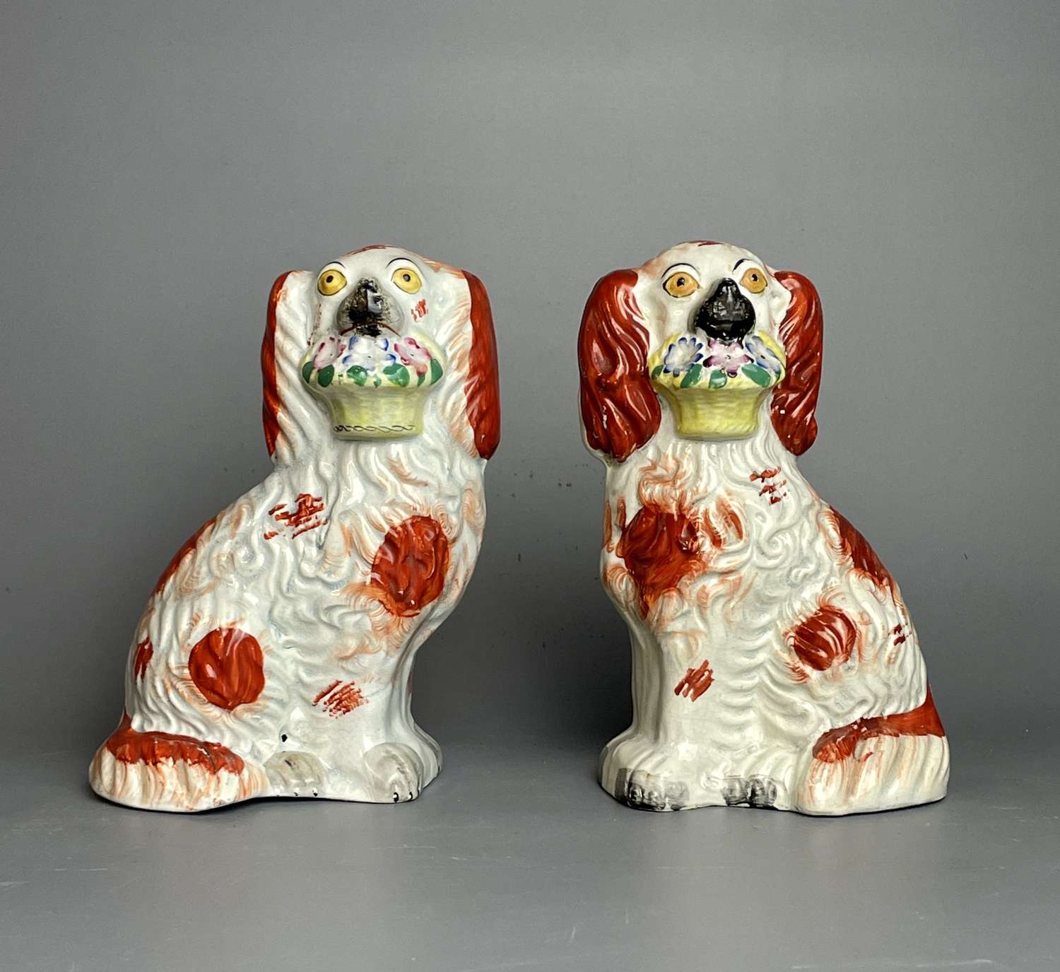 Pair of Victorian Staffordshire Dogs with Baskets of Flowers