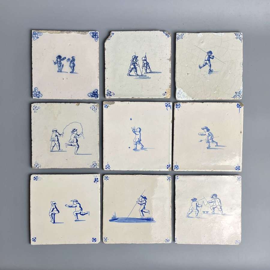 Nine 18th Century Delft Tiles Painted with Children Playing Games
