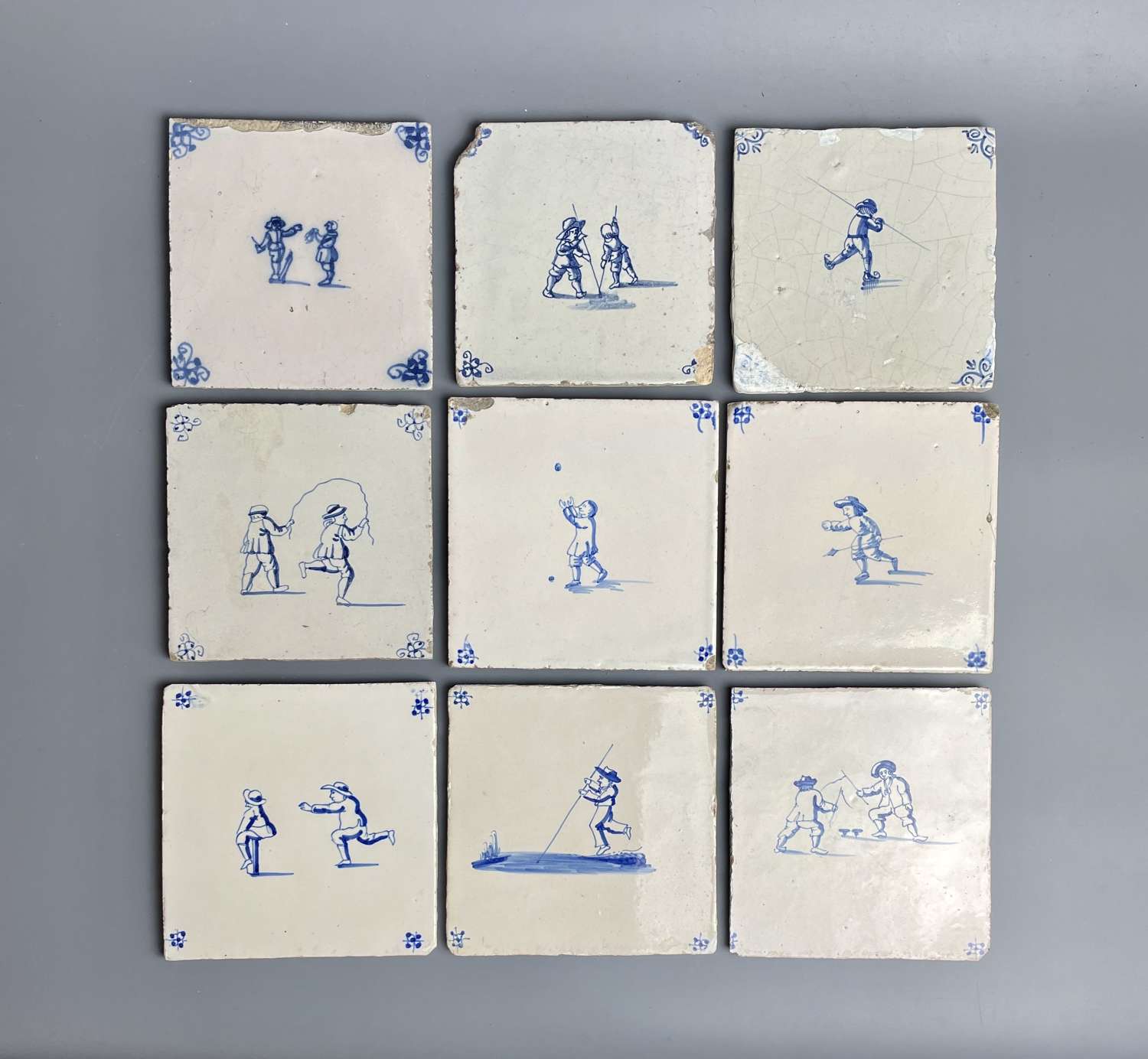 Nine 18th Century Delft Tiles Painted with Children Playing Games