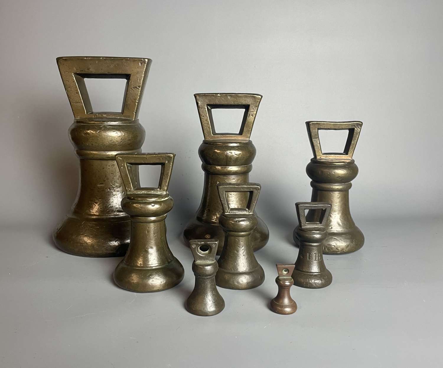 Set of 8 Georgian Bronze Bell Shaped Trade Weights 1826