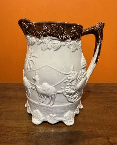 Victorian Yorkshire Pottery Jug Moulded with an Indian Carriage Scene